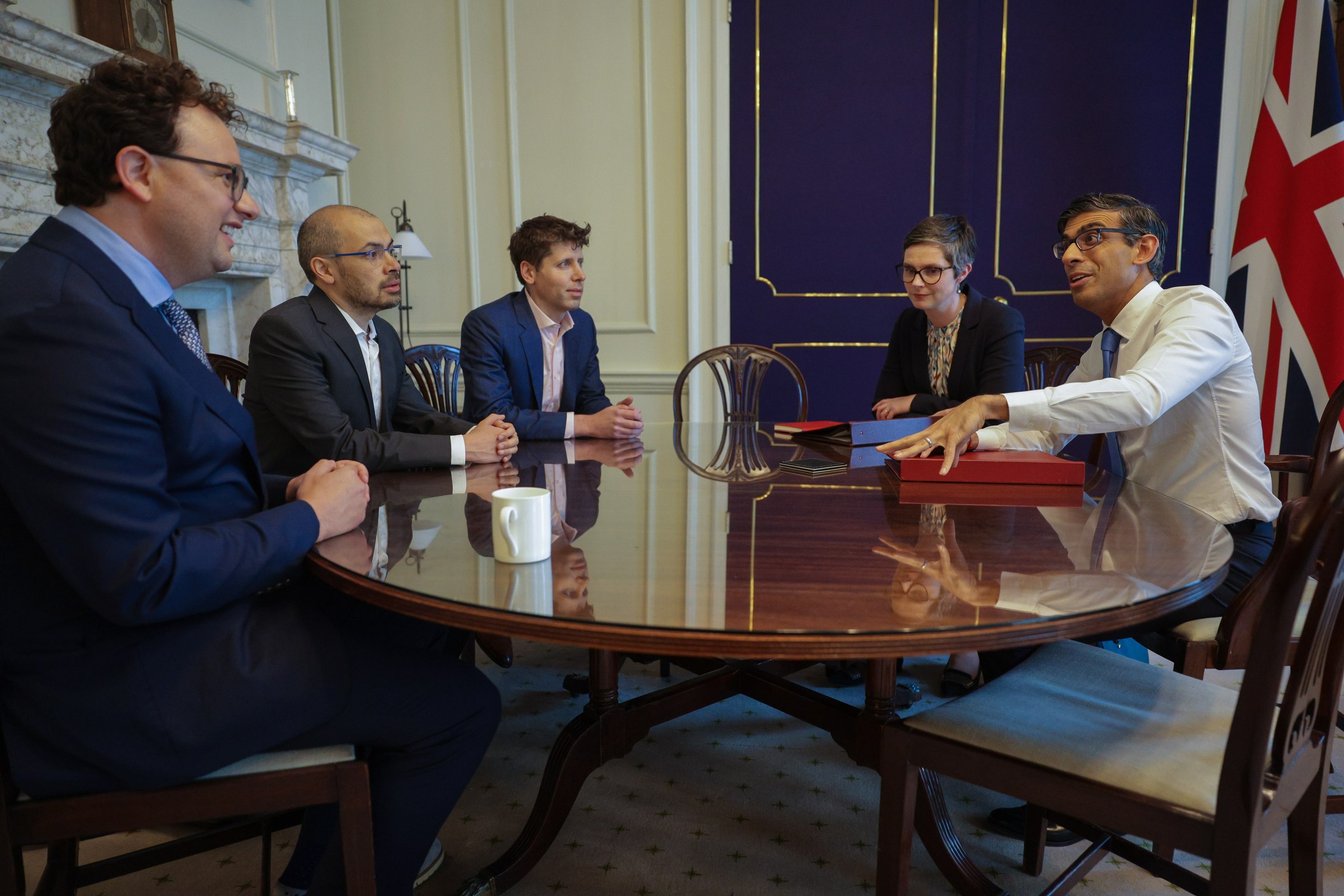 Dario Amodei, Demis Hassabis and Sam Altman sit at a round table with Rishi Sunak in Downing Street.