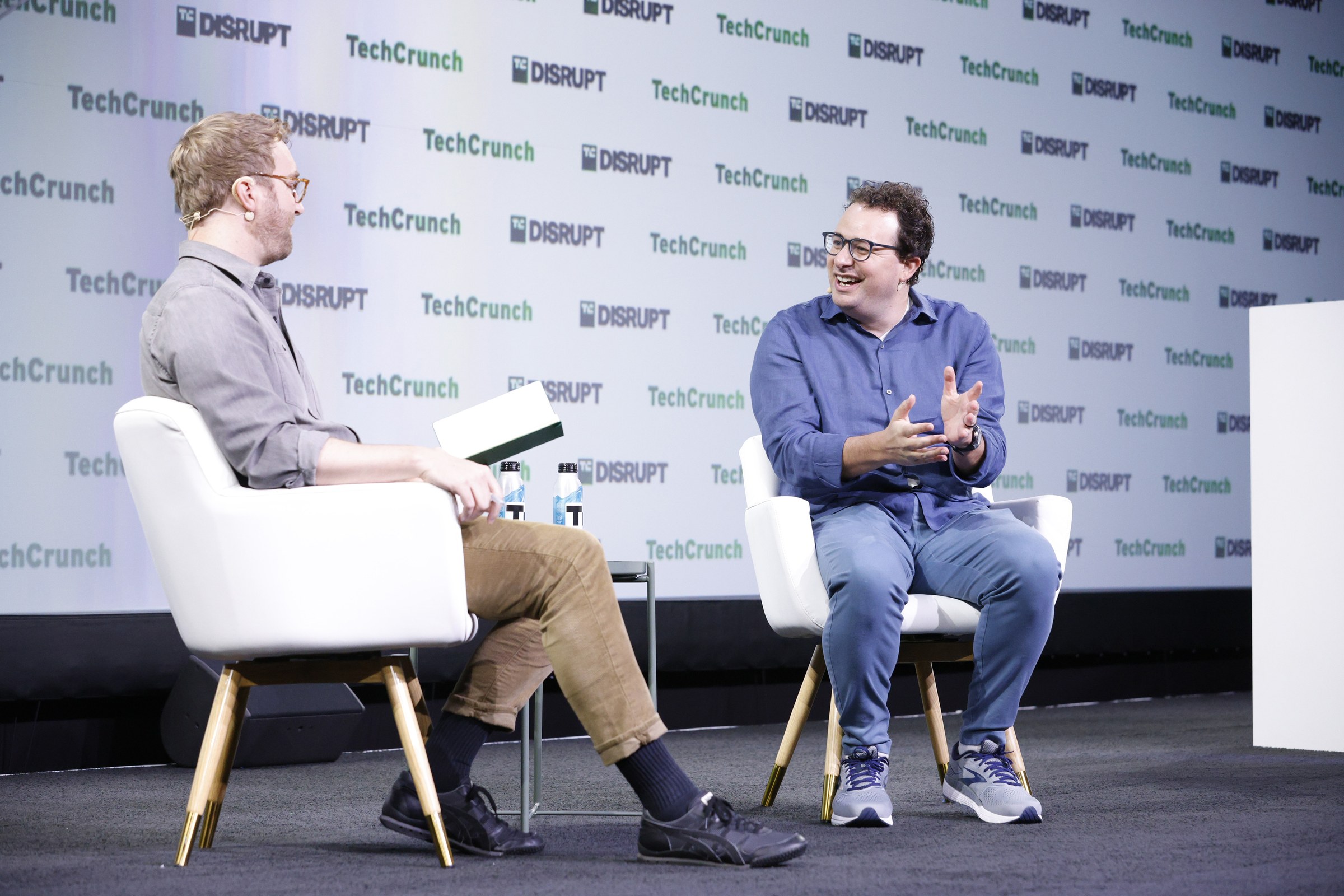 Dario Amodei on stage at TechCrunch Disrupt during a conversation.