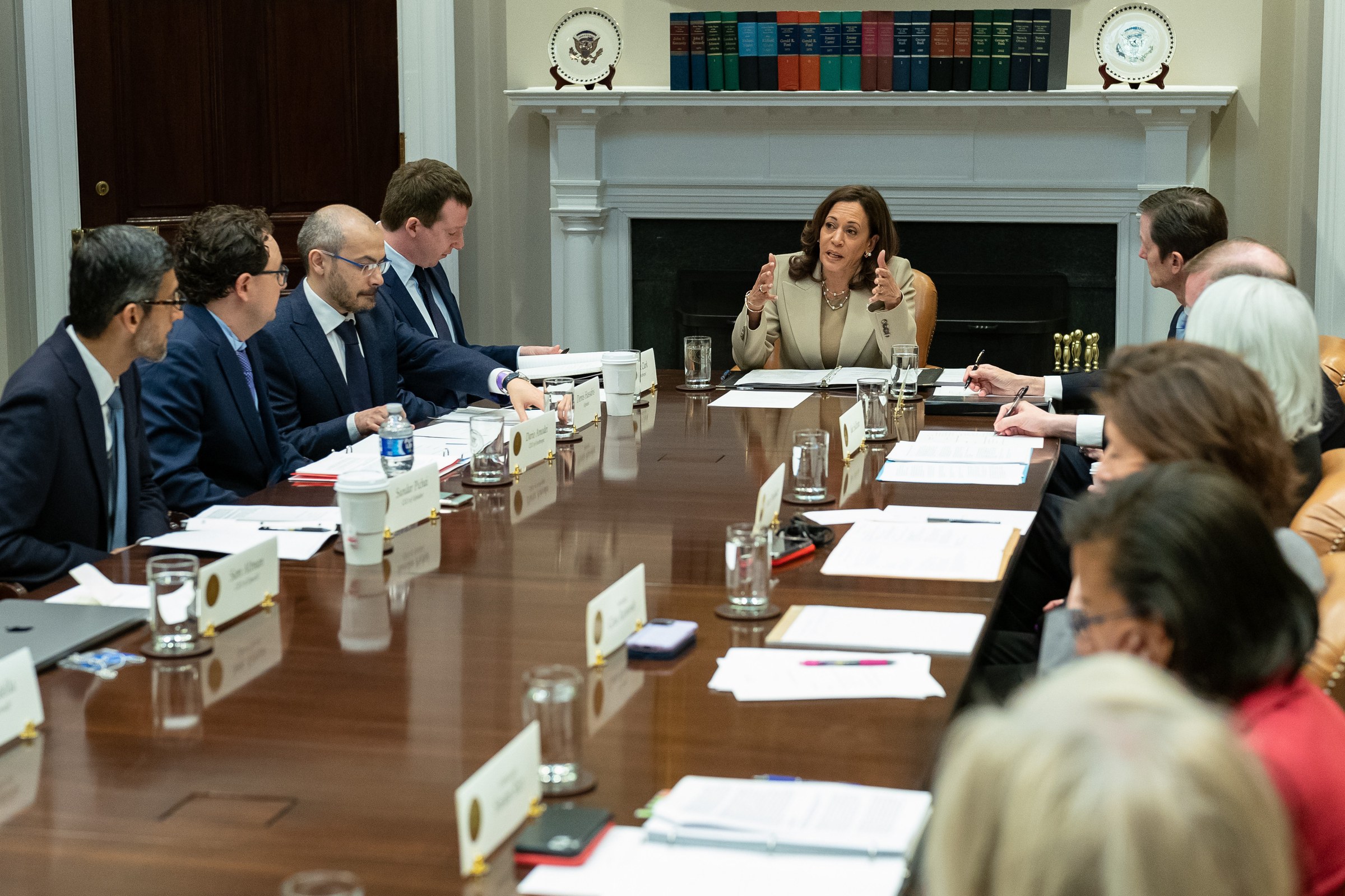 Kamala Harris speaks across a long table to technology executives, Dario Amodei among them.